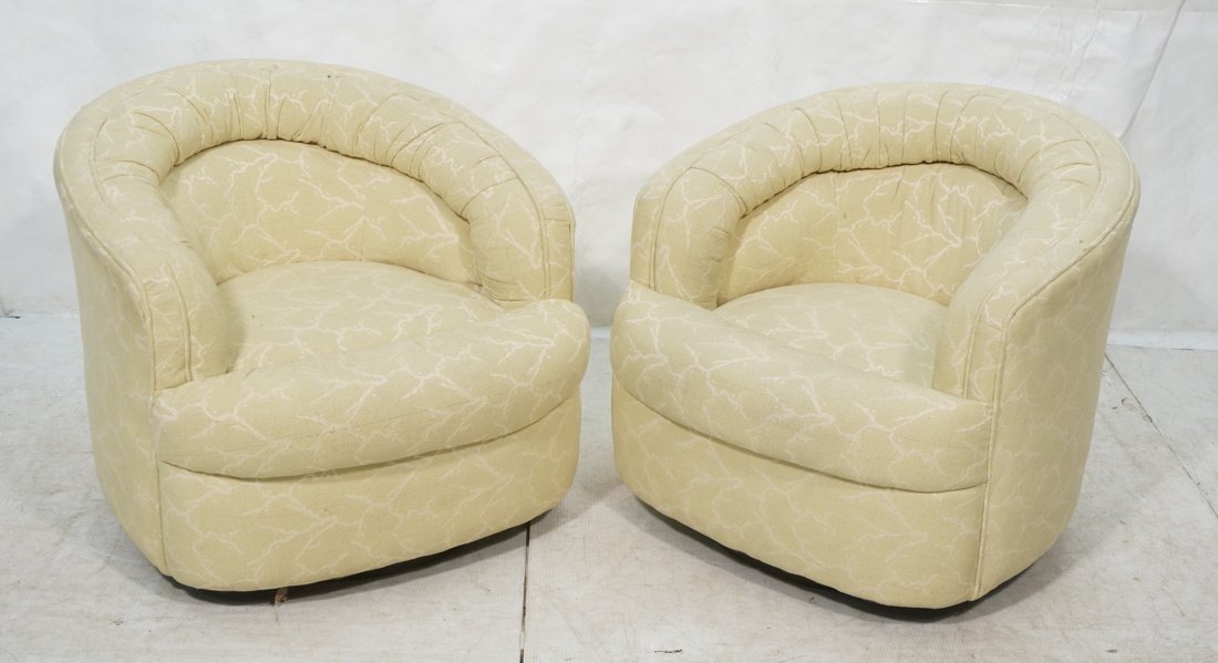 Pr Swivel Barrel Back Lounge Chairs. Selig Label: Pr Swivel Barrel Back Lounge Chairs. Pale yellow cream fabric. Fat upholstered back -- Dimensions: H: 27 inches: W: 30 inches: D: 30.5 inches ---