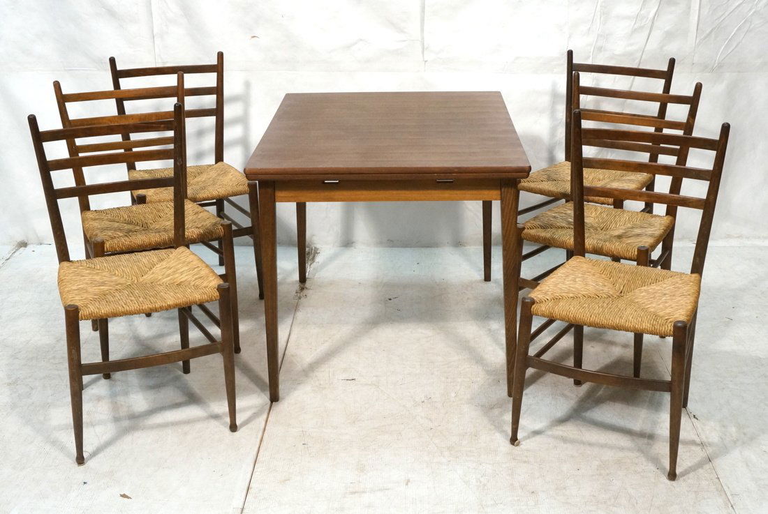 Modern Dining Room Set. Six Chairs with woven rus: Modern Dining Room Set. Six Chairs with woven rush seats. Three slats back rest. Stained wood. Refractory wood table with pull out leaves.-- Dimensions: H: 29 inches: W: 31 inches: D: 41.25 inches ---