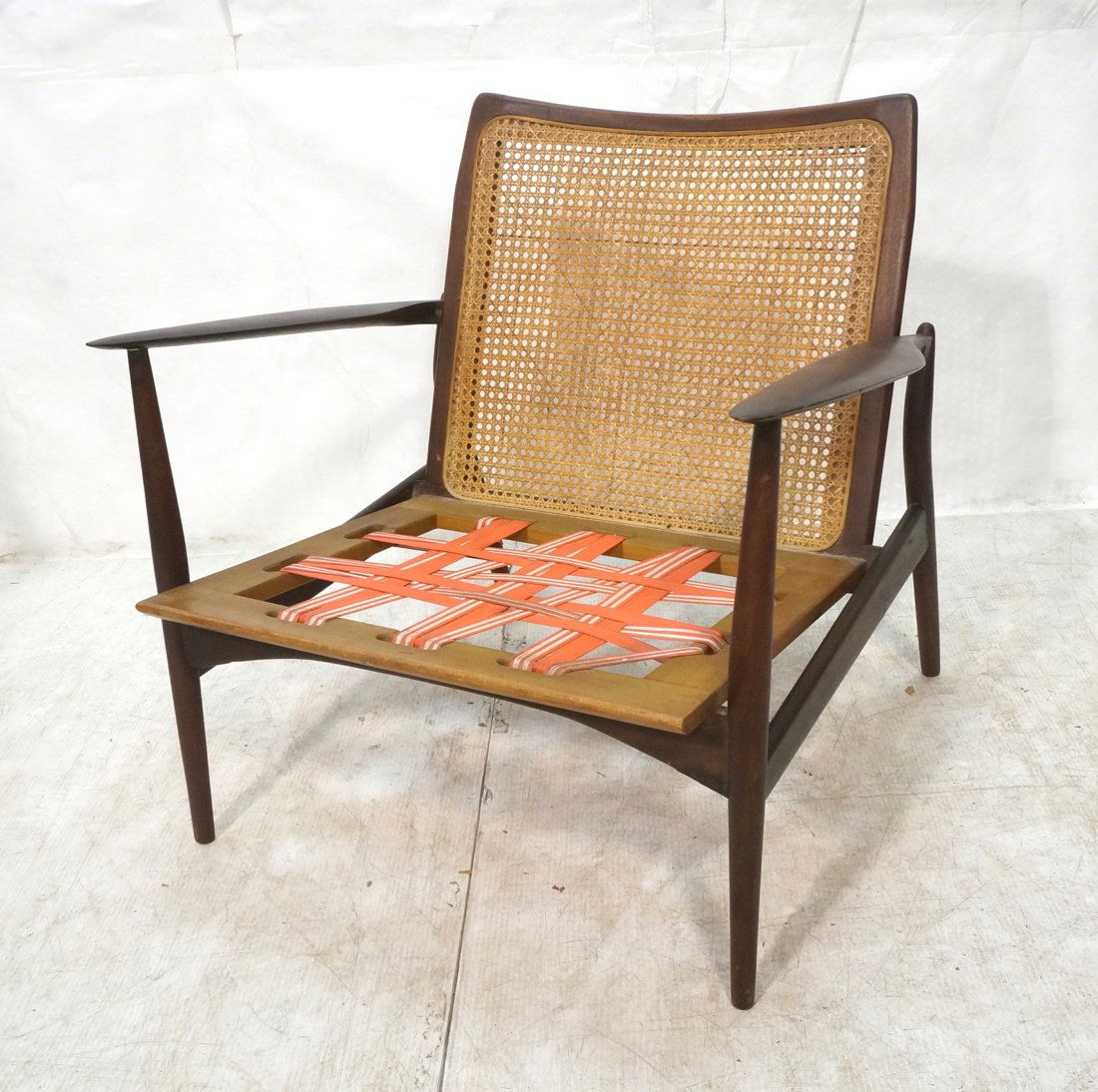 Kofod - Larsen Selig Lounge Chair. Caned Back wit: American Modern Wood Lounge Chair. Caned Back with bowed detail. Wide paddle arms. -- Dimensions: H: 28.5 inches: W: 28.5 inches: D: 27 inches ---