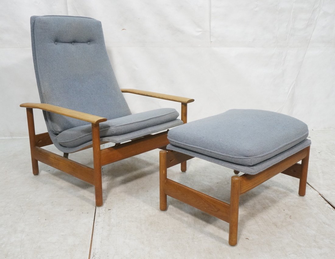 Modernist Lounge Chair & Ottoman. Wide paddle arm: Modernist Lounge Chair & Ottoman. Wide paddle arm Tall Back Chair. Chair reclines. Ottoman is adjustable and slants. Blue fabric. Not marked.-- Dimensions: H: 40 inches: W: 30 inches: D: 30 inches ---