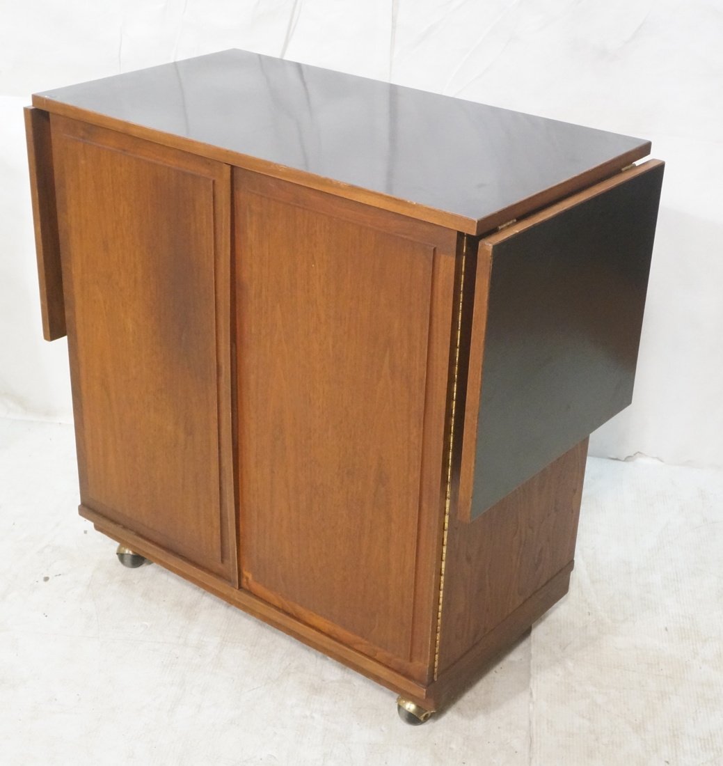 American Modern Bar Cart Server John Kapel: American Modern Bar Cart Server with Black Laminate Top and Drop Sides. 2 door. 15.5 in drops.-- Dimensions: H: 34 inches: W: 34.25 inches: D: 19 inches ---