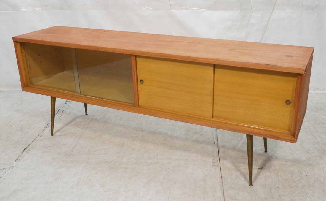 Four Sliding Door Low Cabinet. Metal tapered peg: Four Sliding Door Low Cabinet. Metal tapered peg legs. -- Dimensions: H: 26.75 inches: W: 70.5 inches: D: 16 inches ---