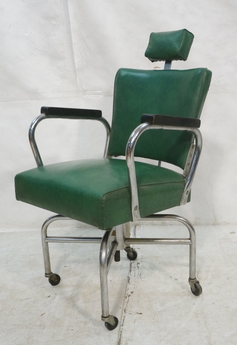 Industrial Modernist Art Deco Green Vinyl Chair.: Industrial Modernist Art Deco Green Vinyl Chair. Chrome arms with black wood rests. Head Rest. Probably commercial use.-- Dimensions: H: 39.25 inches: W: 23 inches: D: 24 inches ---