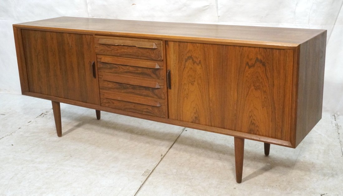 Modernist Rosewood Credenza Sideboard. Tapered pe: Modernist Rosewood Credenza Sideboard. Tapered peg legs. 4 drawer. 2 sliding doors-- Dimensions: H: 32 inches: W: 81 inches: D: 19 inches ---