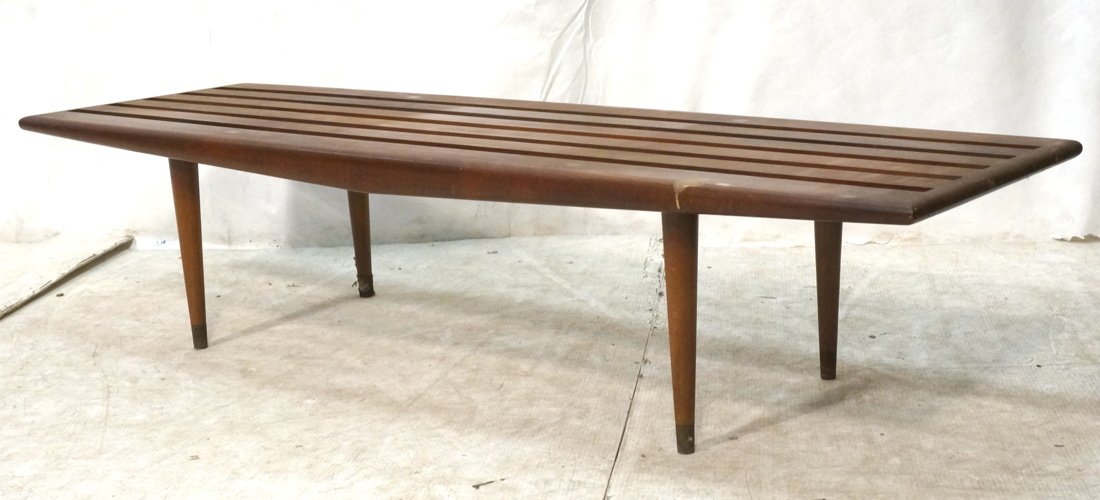 Modernist Slat Bench. Stylish pointed side detail: Modernist Slat Bench. Stylish pointed side detail. Tapered peg legs with brass caps. -- Dimensions: H: 14 inches: W: 60 inches: D: 19.5 inches ---