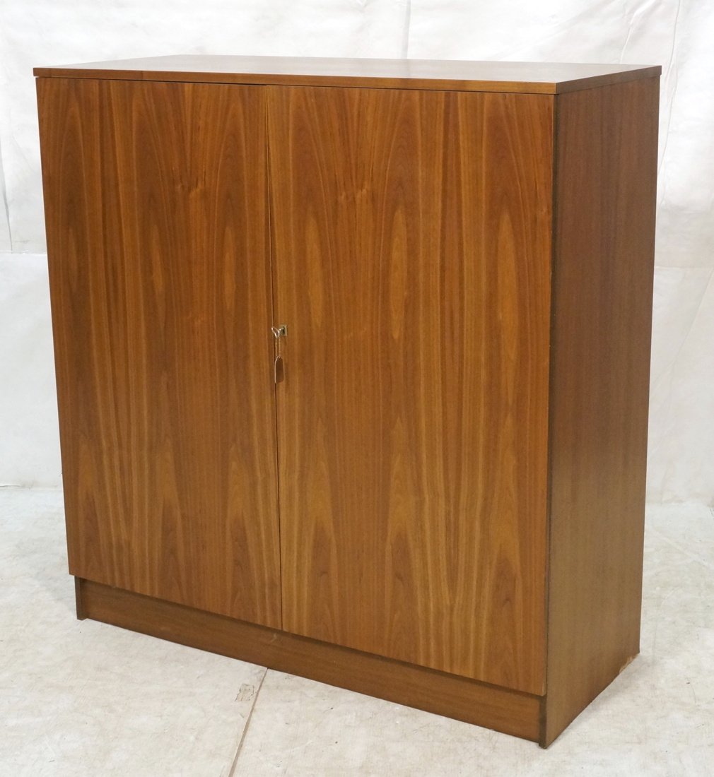 Modernist Wood Two Door Tall Cabinet. Doors open: Modernist Wood Two Door Tall Cabinet. Doors open to reveal drop down desk. Fitted interior. Brass hardware-- Dimensions: H: 51.5 inches: W: 49 inches: D: 20.50 inches ---
