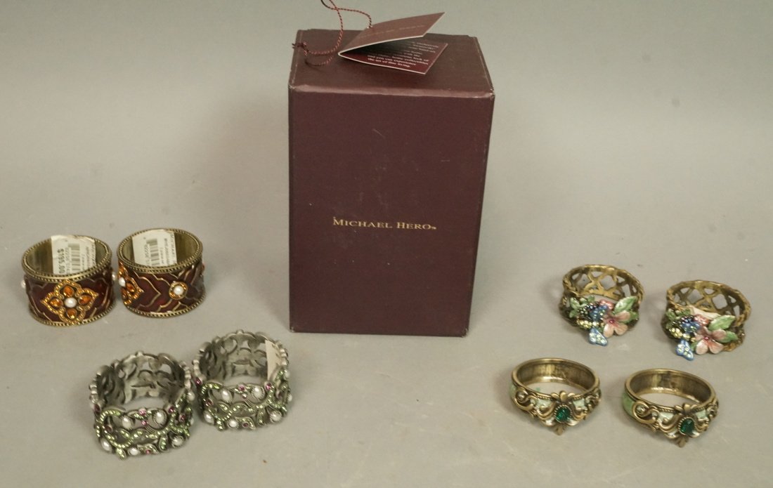 Lot 8 MICHAEL HERO Napkin Rings. Swarovski crysta: Lot 8 MICHAEL HERO Napkin Rings. Swarovski crystals. Four pair of napkin rings with enamel and crystal details. In Michael Hero box. Largest napkin ring is 1 1/8" wide-- Dimensions: --- US Shipping ch
