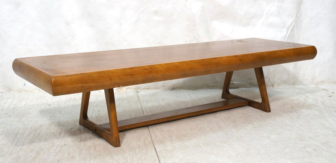 Modernist Wood Coffee Cocktail Table with wide co: Modernist Wood Coffee Cocktail Table with wide contrasting wood curved edge trim. Open triangular leg base-- Dimensions: H: 14 inches: W: 59.5 inches: D: 18.5 inches ---
