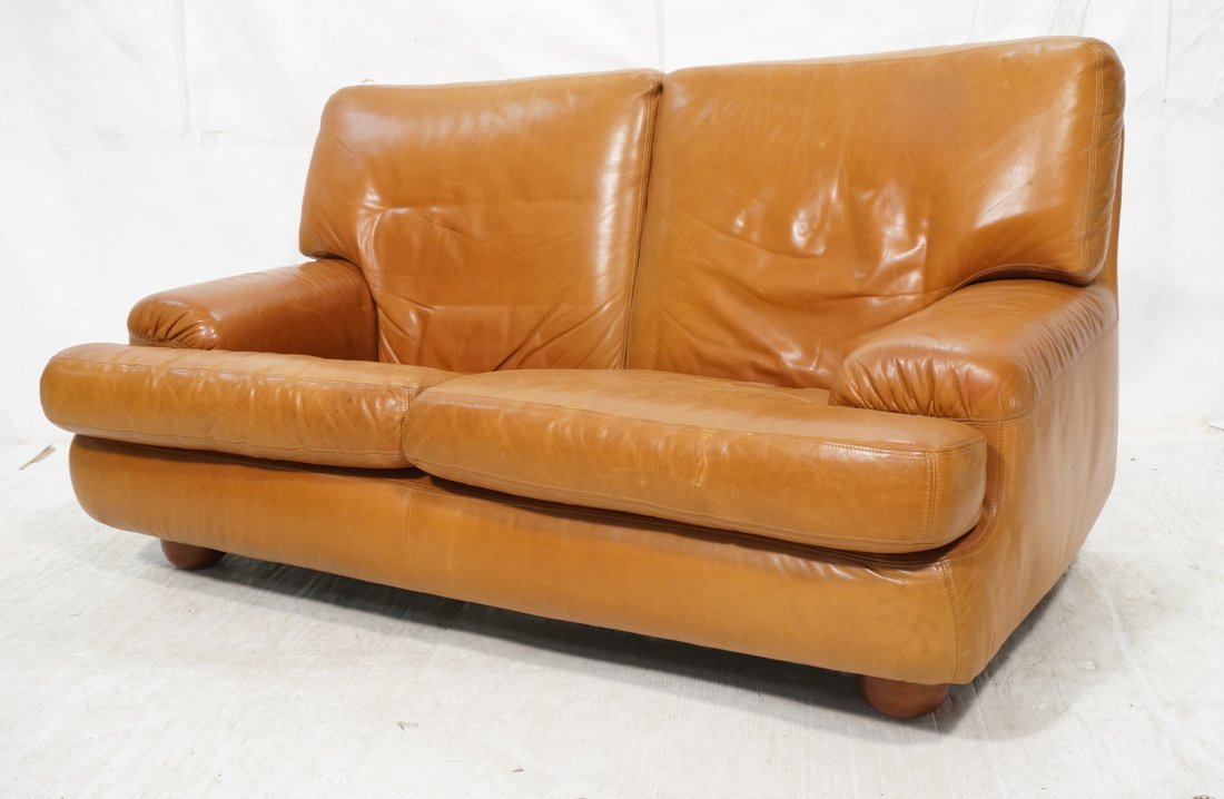 Light Brown Leather Love Seat. Lawsonia. Wood Bun (1 of 10)