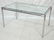 Modernist Chrome & Glass Dining Table. Round chro