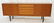 Norway Teak Long Credenza. Raised on Tapered legs