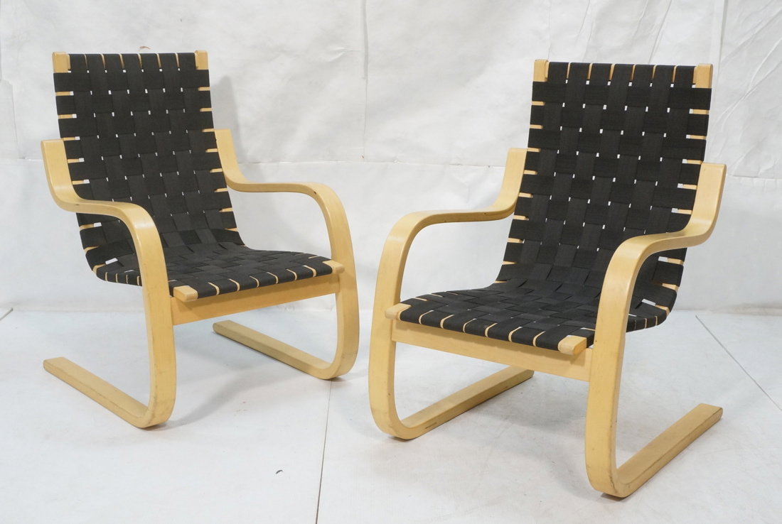Pr ALVAR AALTO for ARTEK ICF Lounge Chairs. Lamin: Pr ALVAR AALTO for ARTEK ICF Lounge Chairs. Laminated Molded Blond Wood Arm Chairs. Woven black webbing. ICF foil sticker. -- Dimensions: H: 36 inches: W: 24 inches: D: 21 inches ---