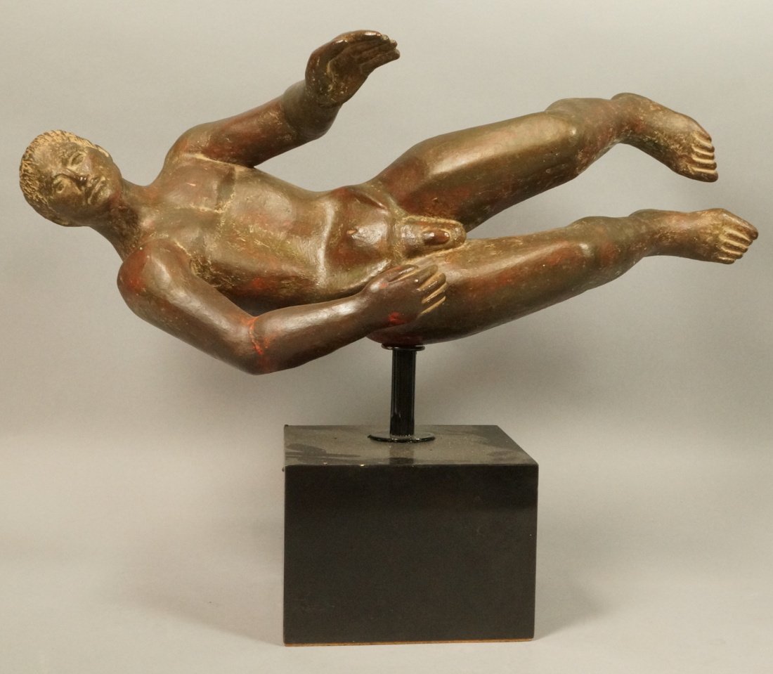Brown Cast Ceramic Sculpture. Figural Horizontal: Brown Cast Ceramic Sculpture. Figural Horizontal Male Nude. Brown paint finish. Black base. Not signed. -- Dimensions: H: 17 inches: W: 22 inches: D: 10 inches ---