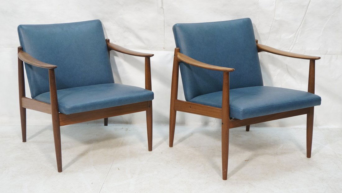 Pr SELIG style Modernist Lounge Chairs. Sloped pa: Pr SELIG style Modernist Lounge Chairs. Sloped paddle arms. Blue vinyl upholstery. Tapered swollen form legs. -- Dimensions: H: 28 inches: W: 25 inches: D: 26 inches ---