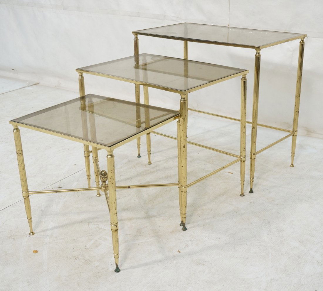Set 3 Nesting Tables. Brass & Glass Regency style: Set 3 Nesting Tables. Brass & Glass Regency style with thin reeded legs. Smoked glass. -- Dimensions: H: 22 inches: W: 24 inches: D: 14 inches ---