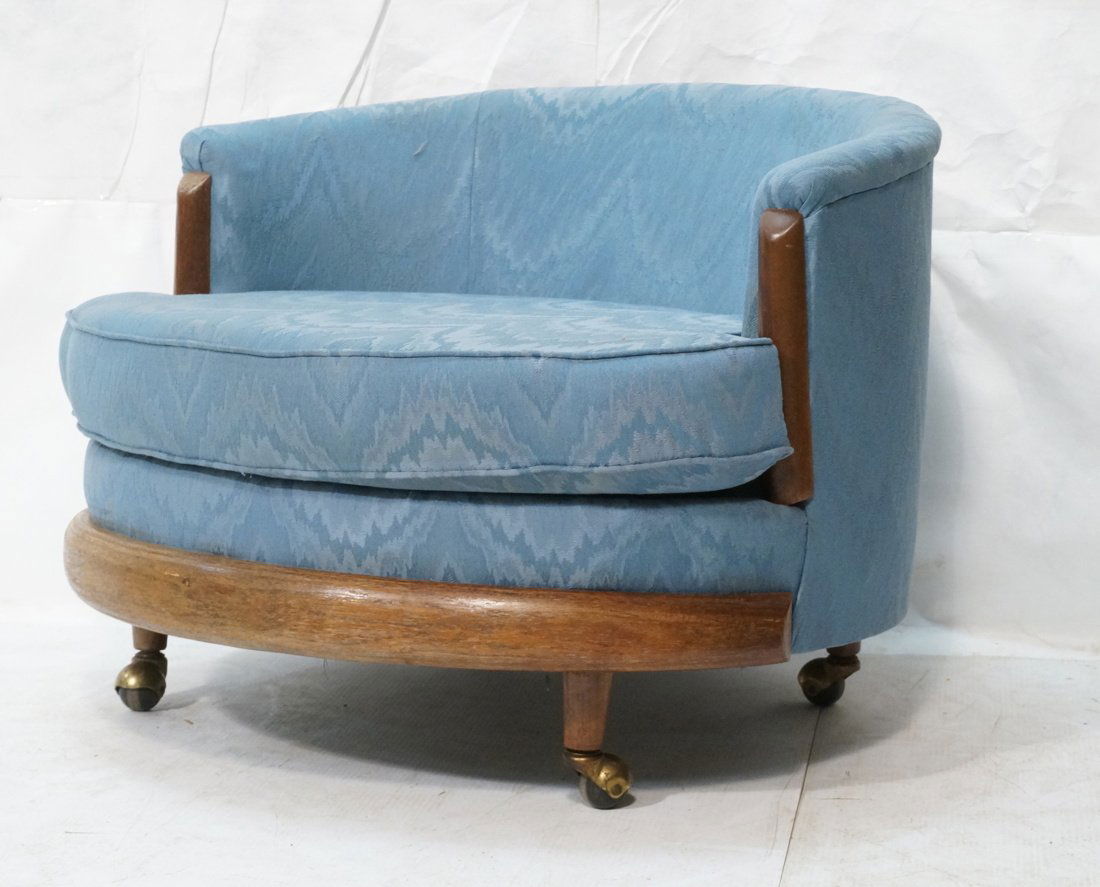 ADRIAN PEARSALL style Barrel Back Lounge Chair. R: ADRIAN PEARSALL style Barrel Back Lounge Chair. Round form rolls on casters. American Modern. Wood skirt and arm fronts.-- Dimensions: H: 25 inches: W: 34 inches: D: 33 inches ---