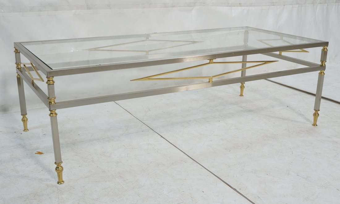 REGENCY Italian Stainless Glass Top Coffee Table.: REGENCY Italian Stainless Glass Top Coffee Table. Stainless tube frame with brass diamond accents and cap feet. Made in Italy label.-- Dimensions: H: 16.5 inches: W: 51.75 inches: D: 24 inches ---