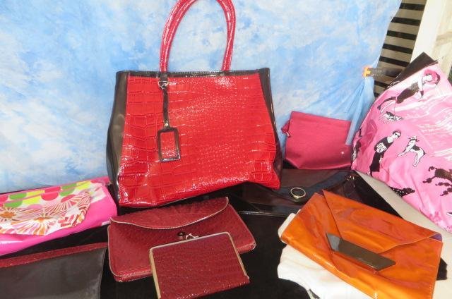Lot of purses: Lot of purses and bags, including make up bags and a new Kenneth Cole Clutch bag All are in new conditon