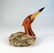 Folk Art Waterfowl A wooden and stone sculpture of a - 2