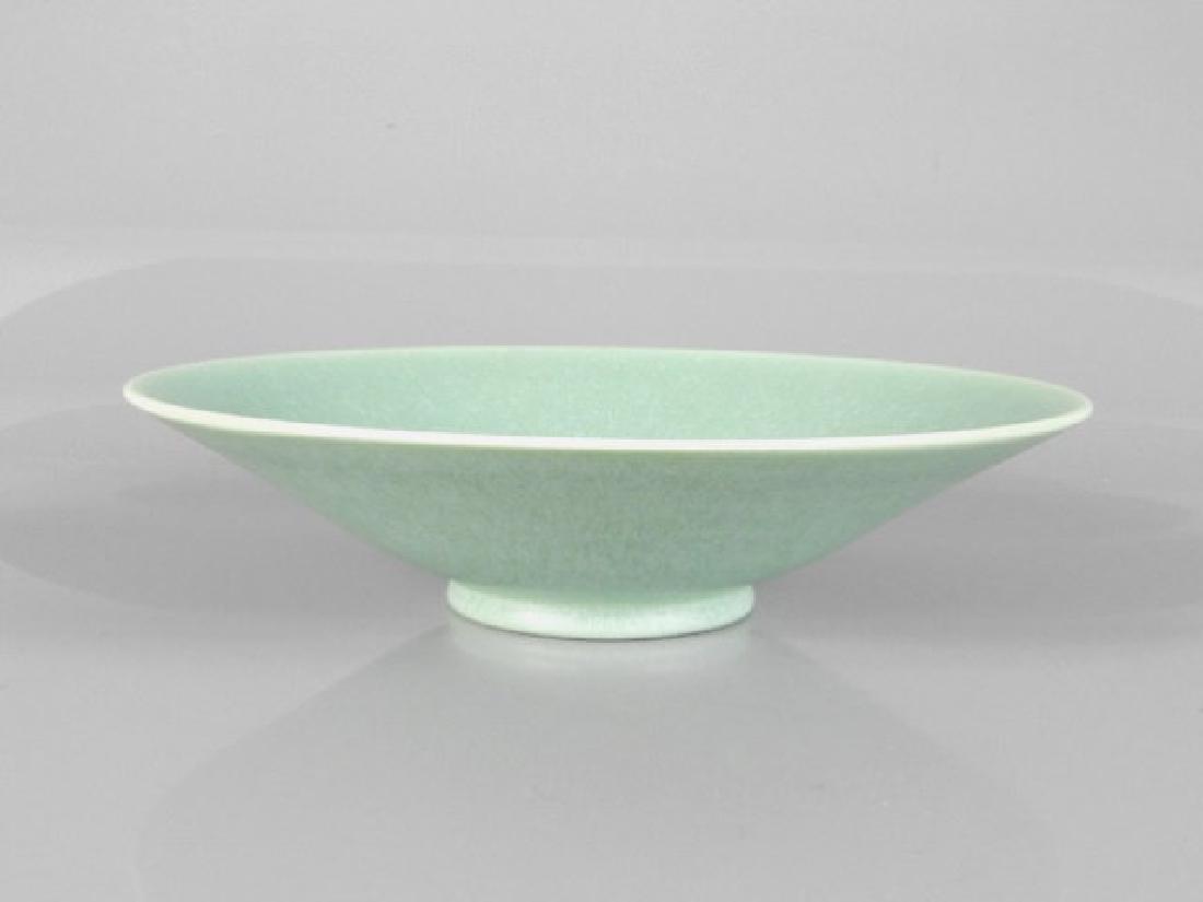 ROYAL LANCASTRIAN BOWL SIGNED E. BUDGES: A Royal Lancastrian bowl designed by Eric Budges, the conical shaped bowl decorated in a flat green glaze, England, 3 x 11 inches.