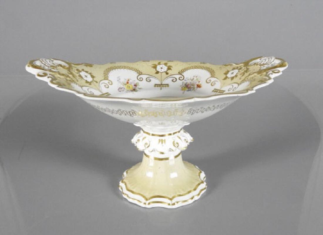 MID-VICTORIAN PORCELAIN TAZZA: Mid-Victorian porcelain tazza, cream colour ground with hand-painted flowers and gilt, British Antique Dealers' Association label, 8" x 13" x 11 1/2".
