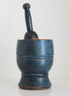 TURNED MORTAR & PESTLE / MORTIER & PILON TOURNÉ: A turned mortar and pestle, original blue paint, excellent form and condition. Quebec, 19th century. Illustrated: Celebrating Canada, page 12. H: 7"; D: 5". // Mortier et pilon en bois 