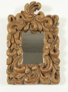 SMALL LOUIS XV MIRROR FRAME / CADRE DE MIROIR: An early Louis XV pine mirror frame with deeply carved scrolls and leaves, carved in one piece of wood. Quebec, mid 18th century. H: 9.5"; W: 6". // Petit cadre de miroir fait d&#8217;une planche de p