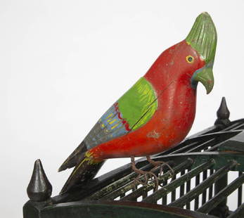 CARVED PARROT / PERROQUET SCULPTÉ, CIRCA 1900: A carved parrot in original vibrant paint with carved comb and twisted wire legs attributed to Jean-Baptiste Côté. See text in Celebrating Canada, page 88-93. Ex collection