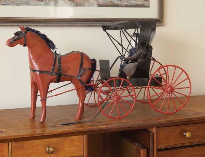 FOLK ART - Jacob ROTH (1896-1995): Jacob Roth, a folky red horse with black harness and a black buggy, with red wheels and two passengers, Punkydoodles Corners (Tavistock), Ontario. 20th century. Illustrated: Celebrating Canada, page 1