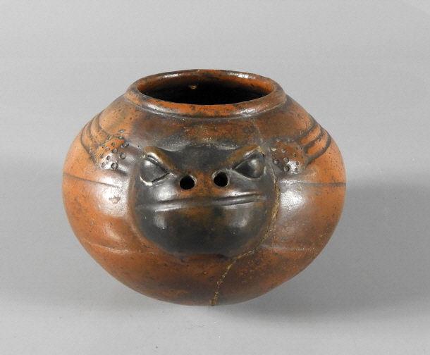 PRE COLUMBIAN REDWARE POTTERY: Pre Columbian redware pottery effigy bowl of globular shape and effecting a stylized lizard, restored major crack. Possibly Costa Rica. Height, 4.5" h x 6" diameter.