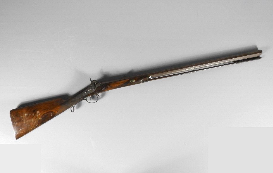 19TH CENTURY R. WYLLIE RIFLE: A 19th century R. Wyllie (British) percussion cap muzzle loading gun, octagonal barrel with dual rear flip sights, ram rod with hidden cleaning threads, maker's name engraved behind flint lock, Auchin
