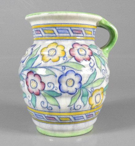 ART - Charlotte RHEAD (1885-1947, British): Charlotte Rhead, for Crown Ducal, a ribbed jug decorated in pastel greens and blues. Dimensions, 8.5" x 7".