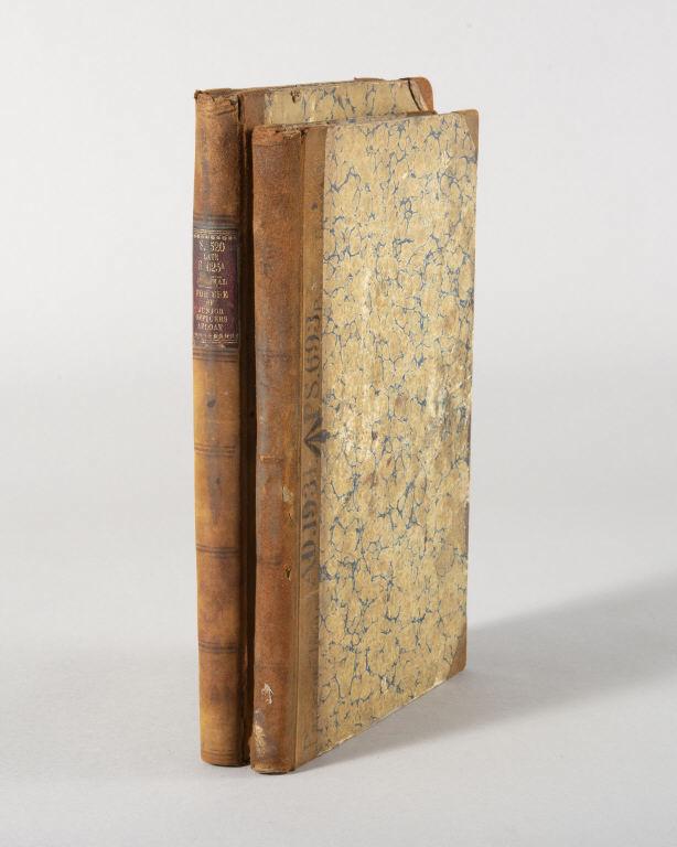 U.K. NAVAL LOGBOOKS OF HMS TALBOT, CIRCA 1898: Two United Kingdom Naval logbooks delineating junior Officer Preston Thomas' time aboard the maiden voyage of HMS Talbot. A fascinating glimpse into history, filled with daily journal entries, maps an