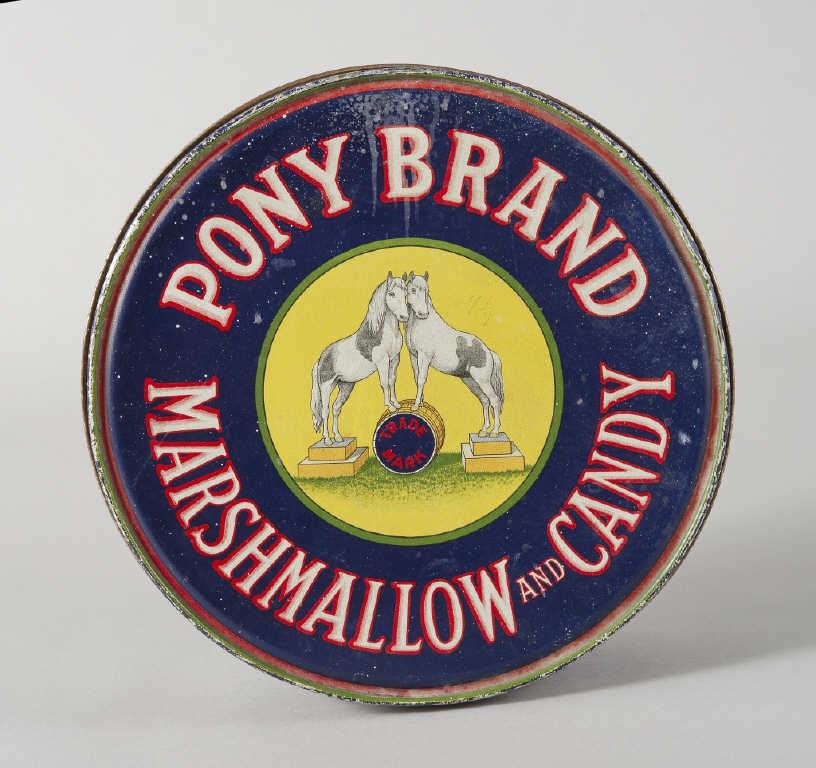LARGE PONY BRAND MARSHMALLOW & CANDY TIN: A large Pony Brand Marshmallow and Candy tin. All over excellent graphics, with crossed British and Canadian flags on the sides. French and English language on this early and impressive tin. Dimension