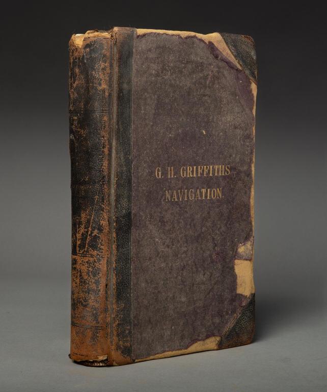 BOOK - HAND WRITTEN NAVIGATION RECORDS: G. H. Griffiths' Navigation Records, 2 volumes, written by hand, with hand drawings of signal flags, Morse code, and tidal patterns, etc. Undated.