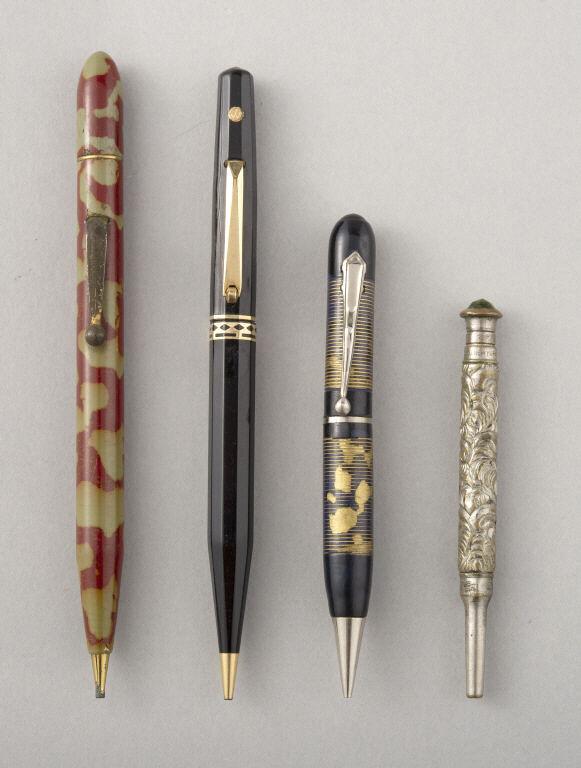 FOUR MECHANICAL PENCILS: A group of four mechanical pencils. (1) A black and gilt Waterman. (2) A red mottled Merit. (3) A small black and gold bakelite. (4) A silver plated Eagle Co. NY with a green gemstone pummel. Longest,