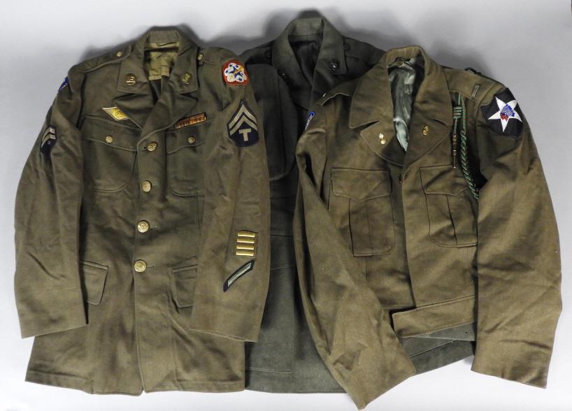 AMERICAN WORLD WAR II SERVICE JACKETS: Three American World War II service jackets, each with various patches, lanyard and ribbons. To include the 2nd Infantry Division and the U.S. Army Corps XI Division "Dice”.