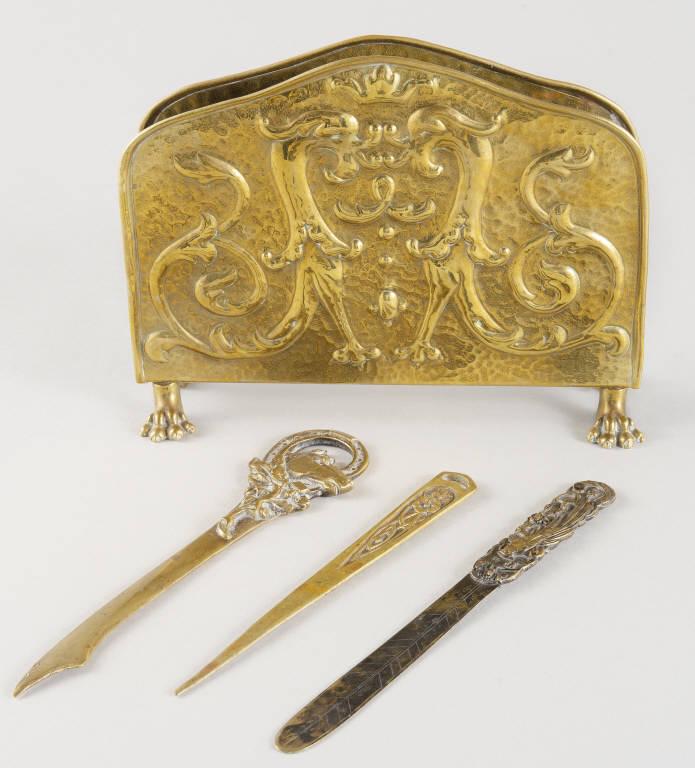 BRASS LETTER HOLDER & OPENERS: A good hammered brass letter holder, embossed with a heraldic crest, resting on lion's feet, marked "Made in Belgium". Along with a Japanese Meiji period letter opener decorated with a Bird of paradis