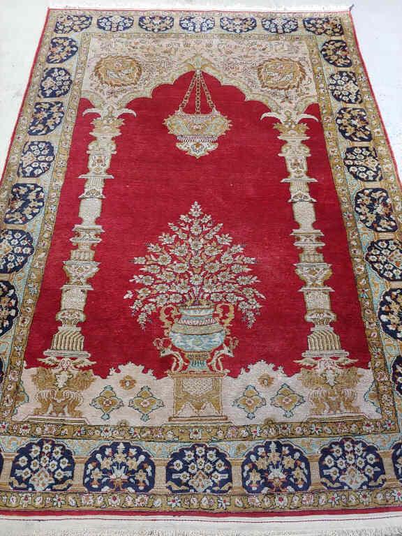 PERSIAN QUM SILK RUG: A Persian Qum silk prayer rug, silk on silk, circa 1960. Few small lot spots, few small stains. Dimensions, 4'6" x 6'8".