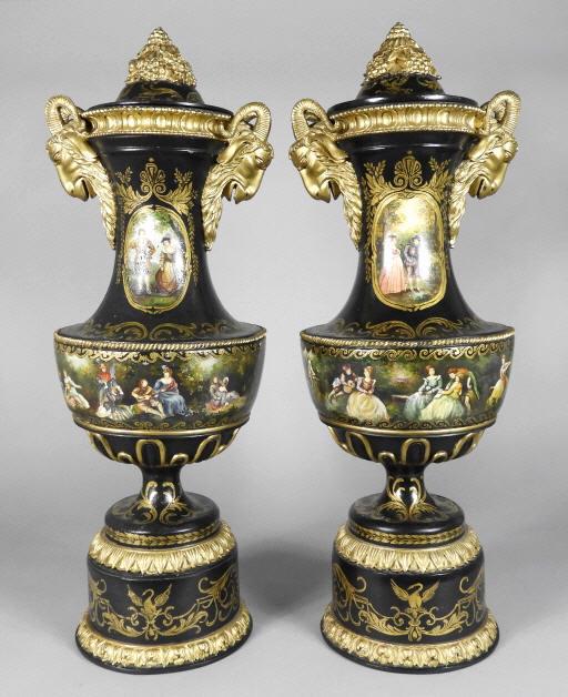 IMPRESSIVE PAIR OF TURNED & EBONIZED URNS: An unusual and impressive pair of 19th century turned and ebonized lidded wooden urns, richly decorated overall with gilt motifs and featuring hand painted romantic murals sided by gilded composition 