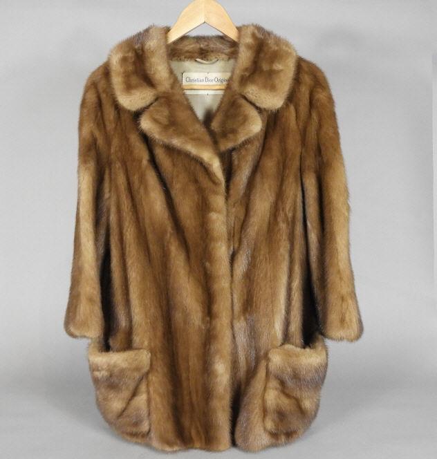 VINTAGE CHRISTIAN DIOR BROWN MINK COAT: A Christian Dior Original three quarter length brown mink coat, full collar, two front pockets. Distributed by Holt Renfrew.