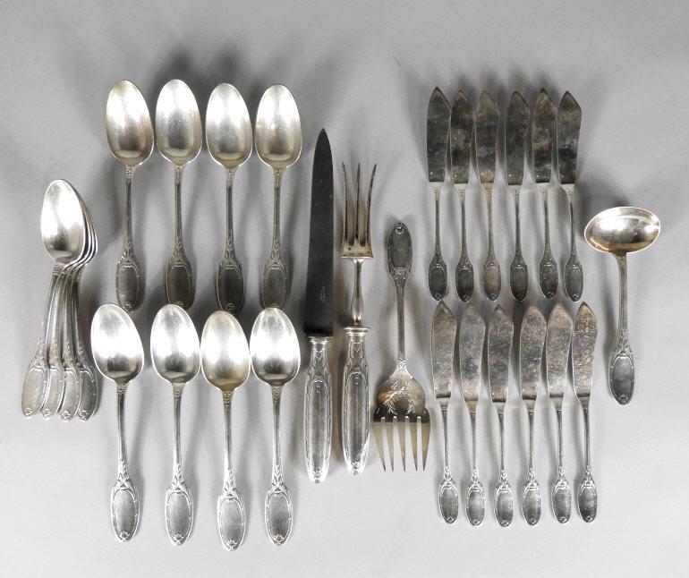 CHRISTOFLE MARIE-ANTOINETTE PATTERN CUTLERY: A 28-piece partial set of antique Christofle, Paris cutlery, 'Marie-Antoinette' pattern. To include, 12 large soup spoons, 12 large butter knives, a carving fork and knife, a ladle and a serving fork.
