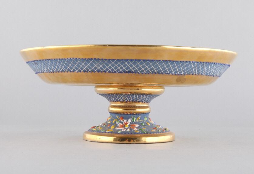 H. BEQUET BELGIUM PEDESTAL CENTREPIECE: An H. Bequet (Belgium) ceramic pedestal centerpiece or fruit stand with a raised floral enamel decoration and gilt trimming. Dimensions, 5.5" h.