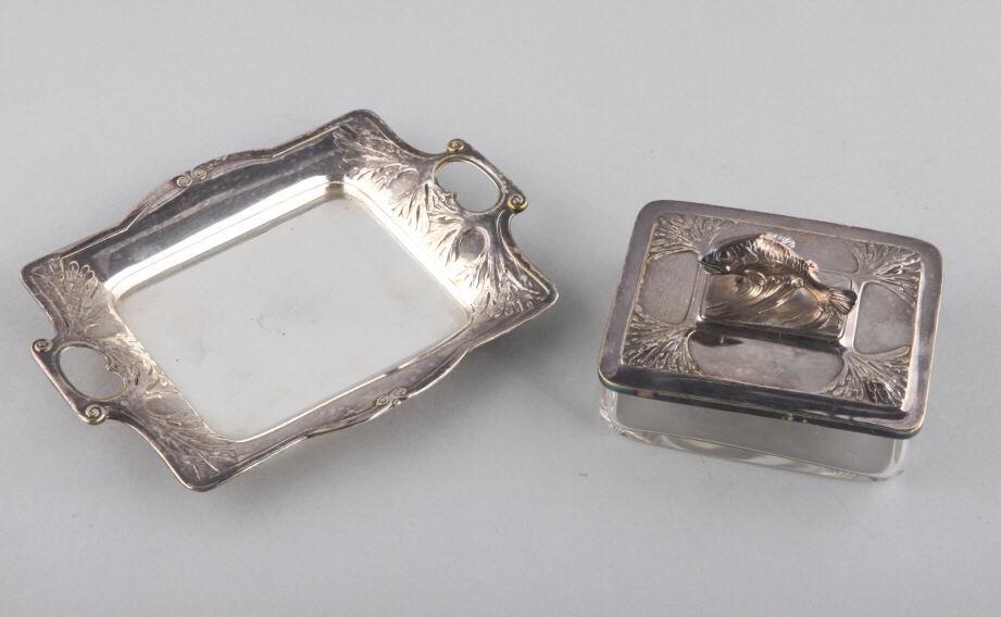 ART NOUVEAU PLATED SARDINE DISH & TRAY: An Art Nouveau silver plated brass sardine dish with a glass dish and tray (three pieces), signed with a faint cartouche "AOG" and design pattern #8690. Dimensions of sardine dish, 3" h (top of fish) 