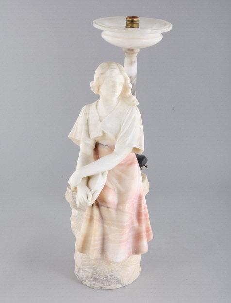 ALABASTER & MARBLE FIGURAL LAMP: A carved alabaster and marble figural Art Deco lamp depicting a young gazing woman. Dimensions, 25" h x 8.5" w x 10" d.