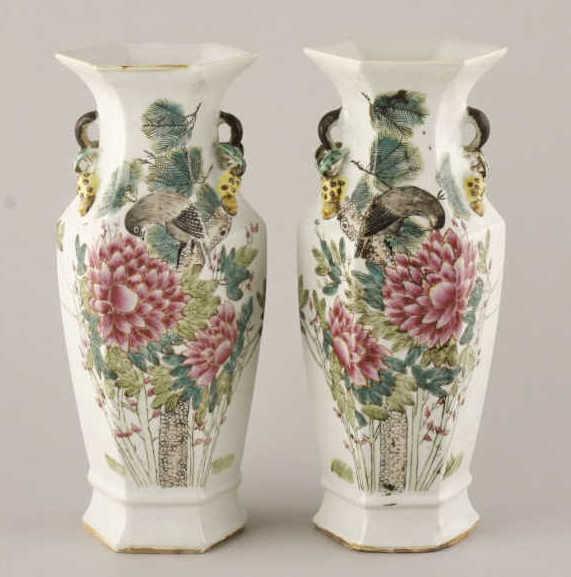 Famille Rose 'Floral and Fauna' Hexagonal Vases: A pair of Chinese Famille Rose 'Floral and Fauna' hexagonal vases, decorated with large pink flowers and birds. Dated 1907. Minor loss to one handle. Height, 12.75".