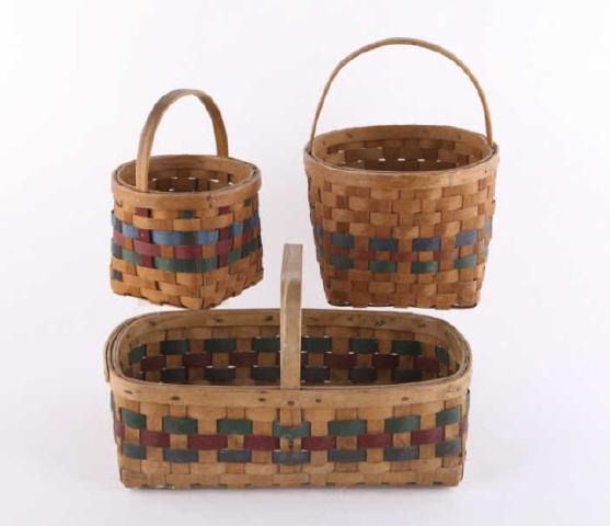 Three Baskets, Golden Lake, Circa 1940: A set of three baskets with matching red and green coloured bands. Made by Lysiak from Golden Lake, Ontario. The baskets were stored for many years in an attic. Circa 1940. Large basket 17" x 11"; sma