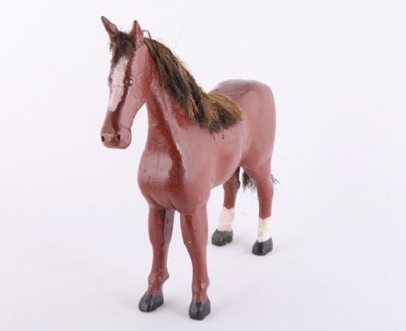 Carving of Horse, by George Desmeules, Québec: A carved horse by Georges Desmeules (1891-1986) in red / brown and white paint with a twine mane and tail. Quebec, 3rd quarter 20th century. H: 22"; L: 24"; D: 4".