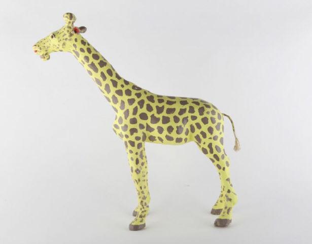 Standing Giraffe, Aimé Desmeules, Circa 1980: A standing giraffe carved by Aime Desmeules (son of Georges) in yellow and taupe paint with a twine tail. Purchased directly from artist. Quebec, circa 1980. H: 33"; W: 30"; D: 6".