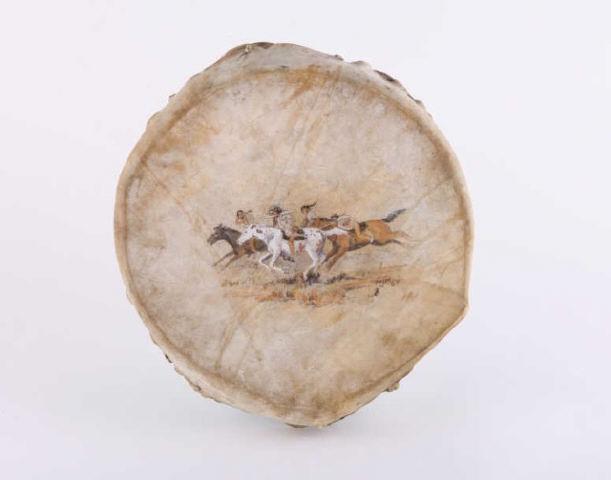 First Nations Drum, by M. Mackenzie, Circa 1968: A decorative First Nations drum with four horsemen painted on hide, rawhide stitching, nice patina. From the Stoney First Nation community in Canmore Alberta, painted by Malcolm Mackenzie, circa 1968.
